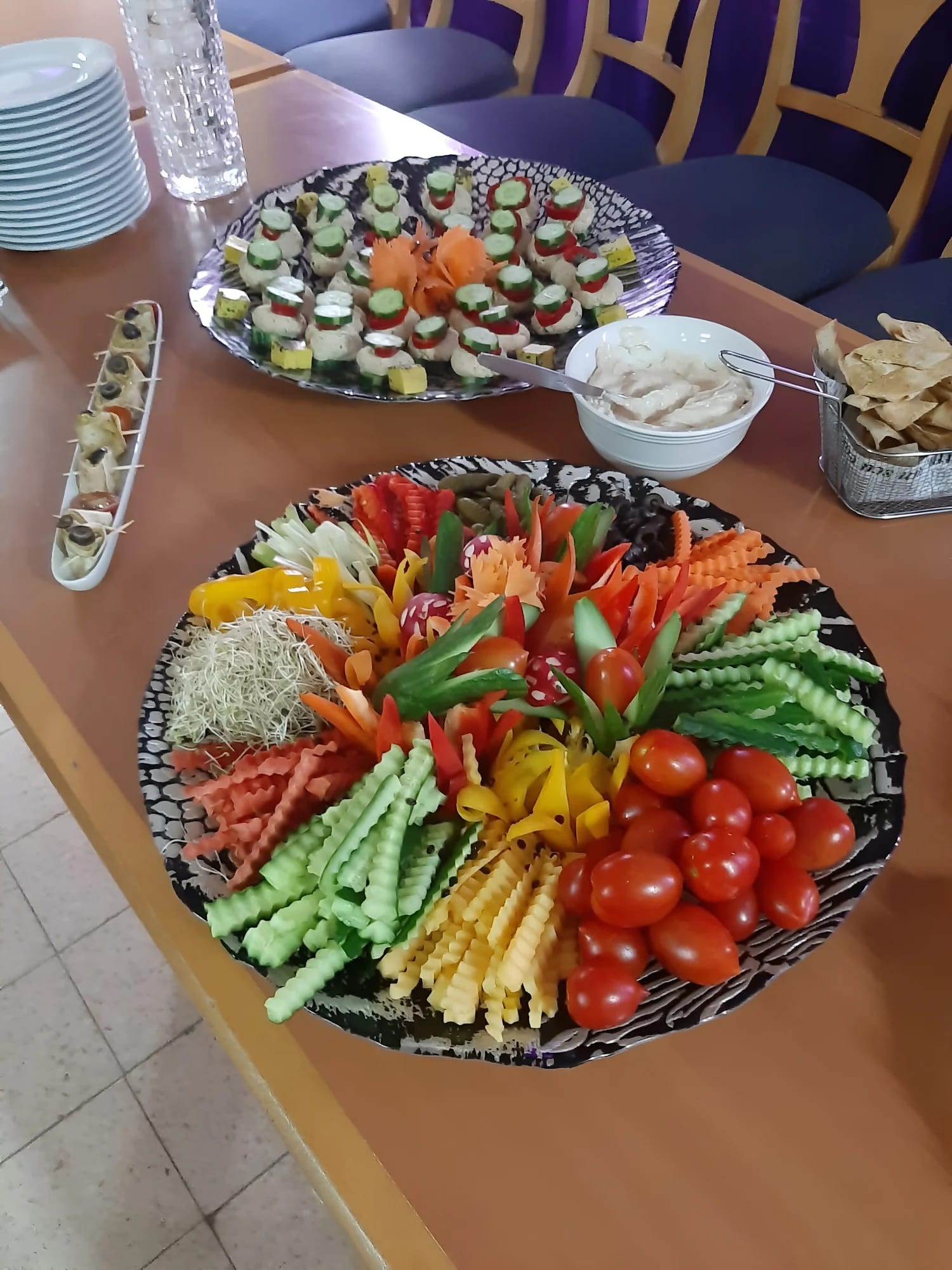 Colourful plant-based vegetable platter prepared for a community gathering
